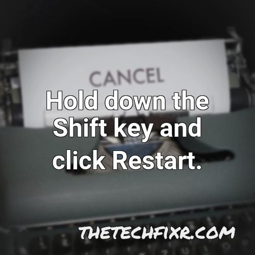 hold down the shift key and click restart