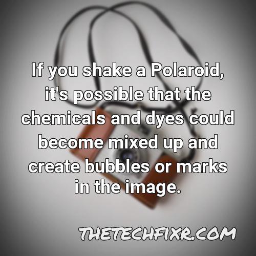 if you shake a polaroid it s possible that the chemicals and dyes could become mixed up and create bubbles or marks in the image